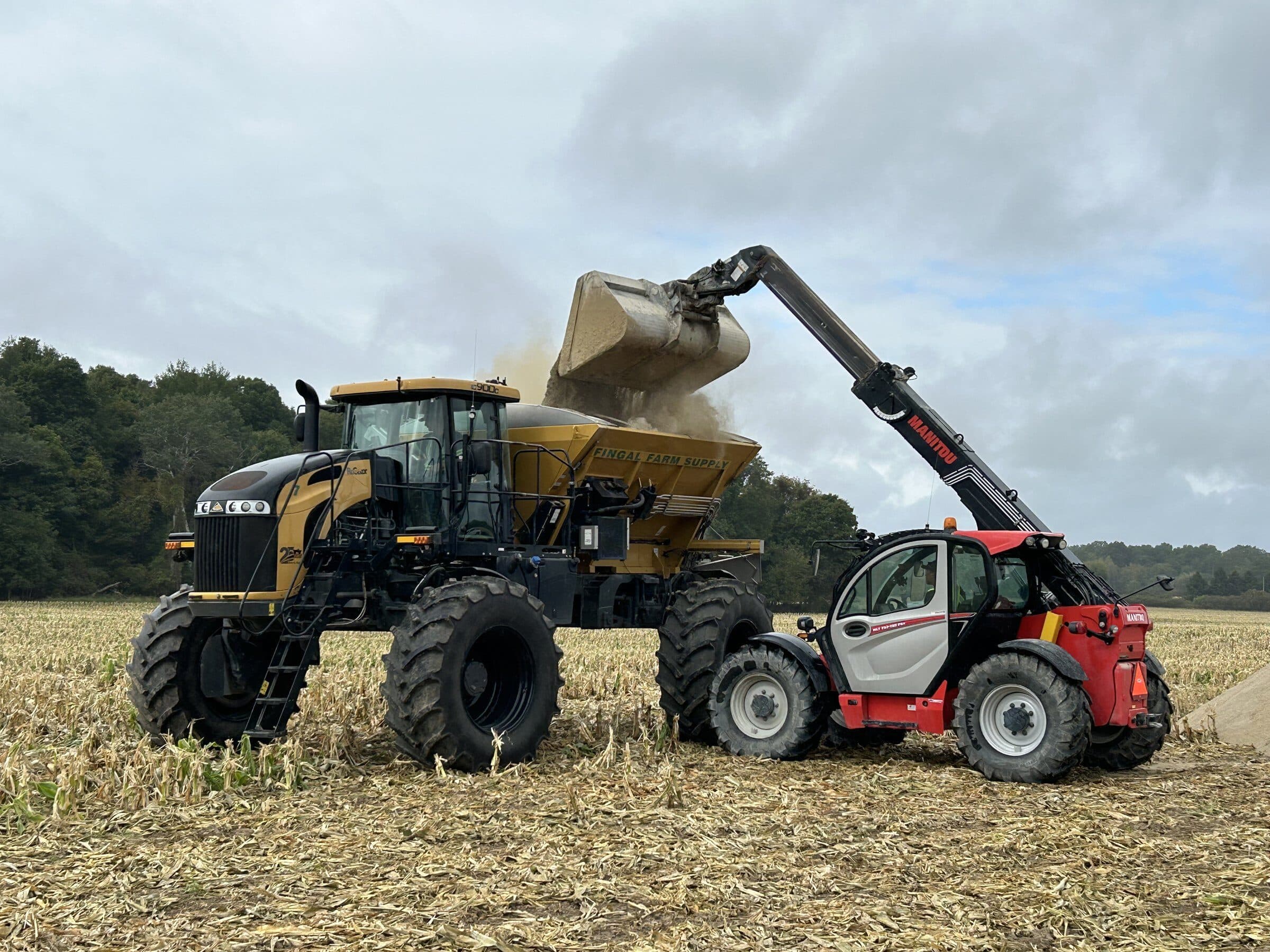 N-Rich fertilizer being poured from a floater spreader during field application